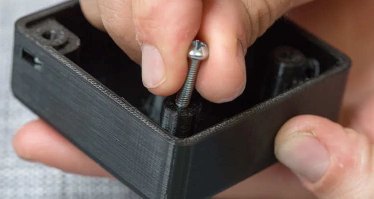 plastic screw threads - Fictiv installation of a screw installed in 3D printed screw threads