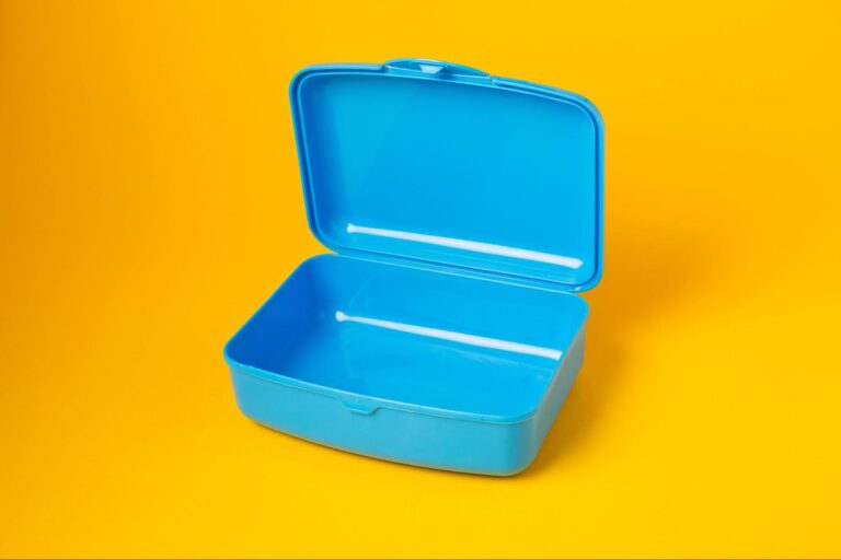 A one-piece plastic box with a living hinge