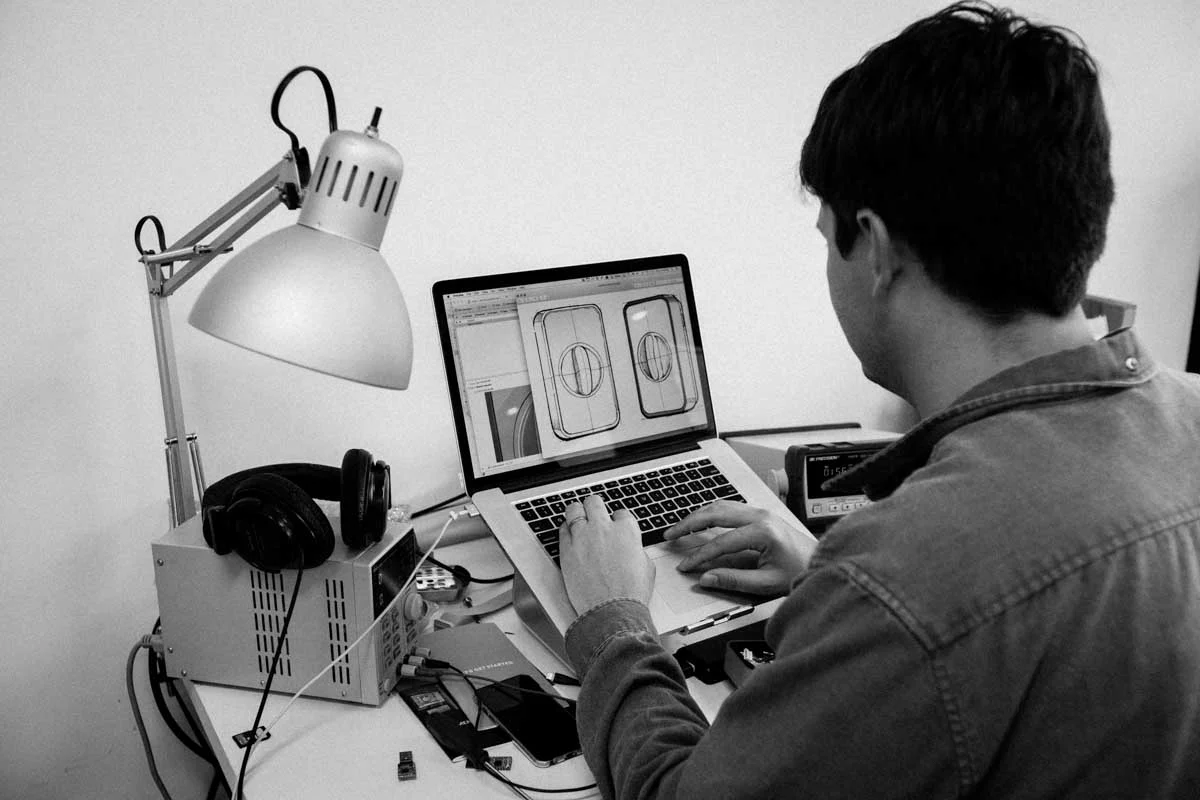 working on a computer - Fictiv working on a computer