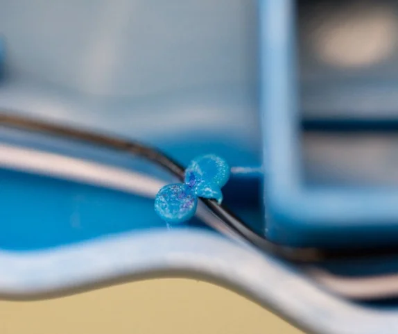 thermoplastic formed bonds securely fasten wires in place—just be careful not to melt the wires beneath (image from our Nerf Lazer Tag Teardown)