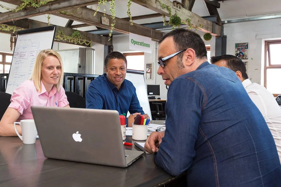 Chatting Team Business Meeting Office Informal - Fictiv Regular ECR review meetings will help streamline changes