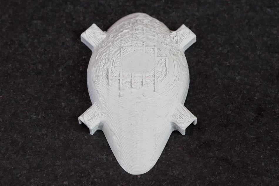 abs-pla-image01 - Fictiv the rougher surface of a PLA printed part after support material is removed