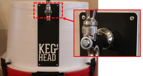 Rivets being used to secure a backing name plate behind the tap on a portable kegerator