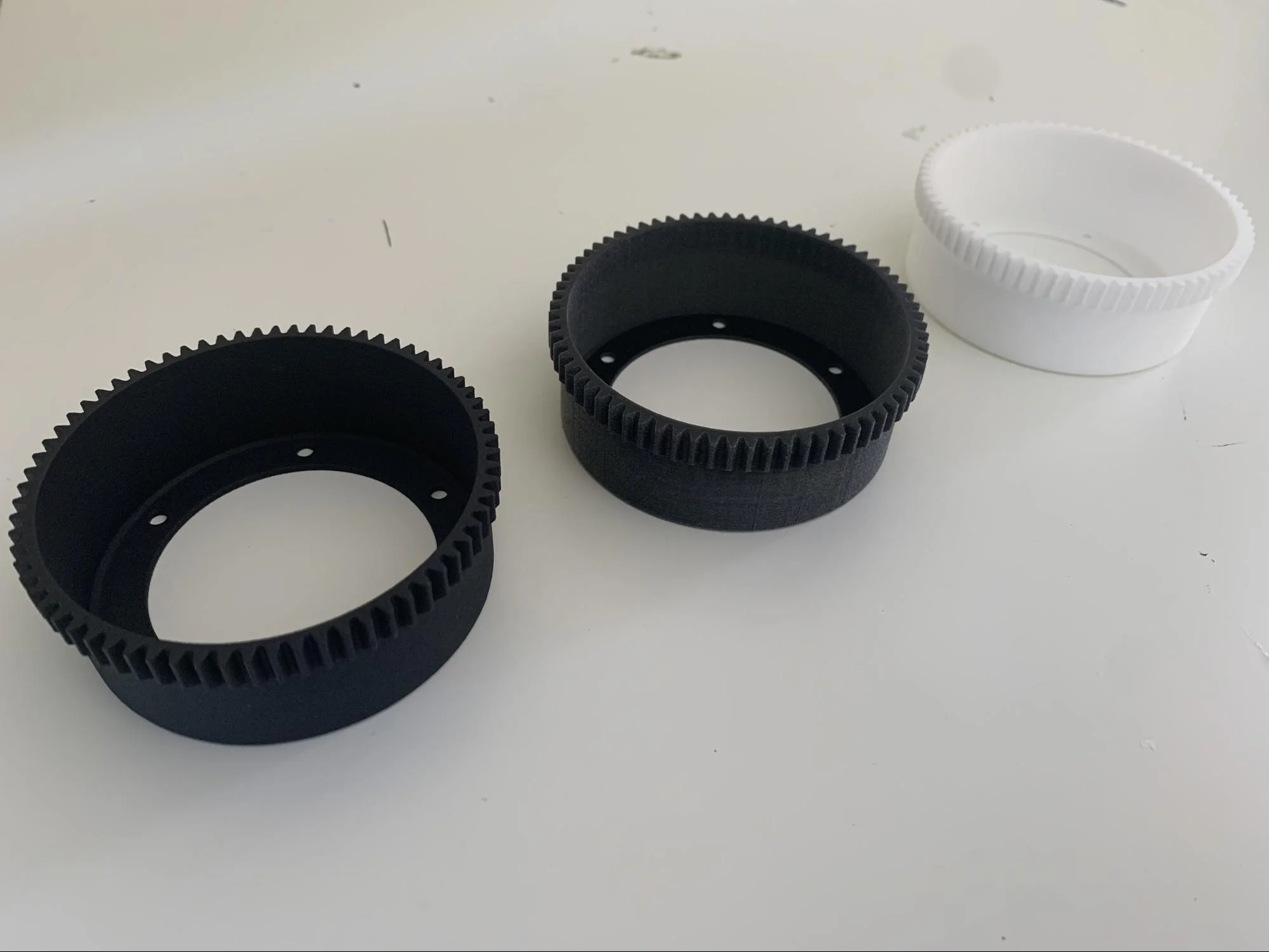 3 different flexsplines: a Multi Jet Fusion one, a Polyjet one, and a Selective Laser Sintering one