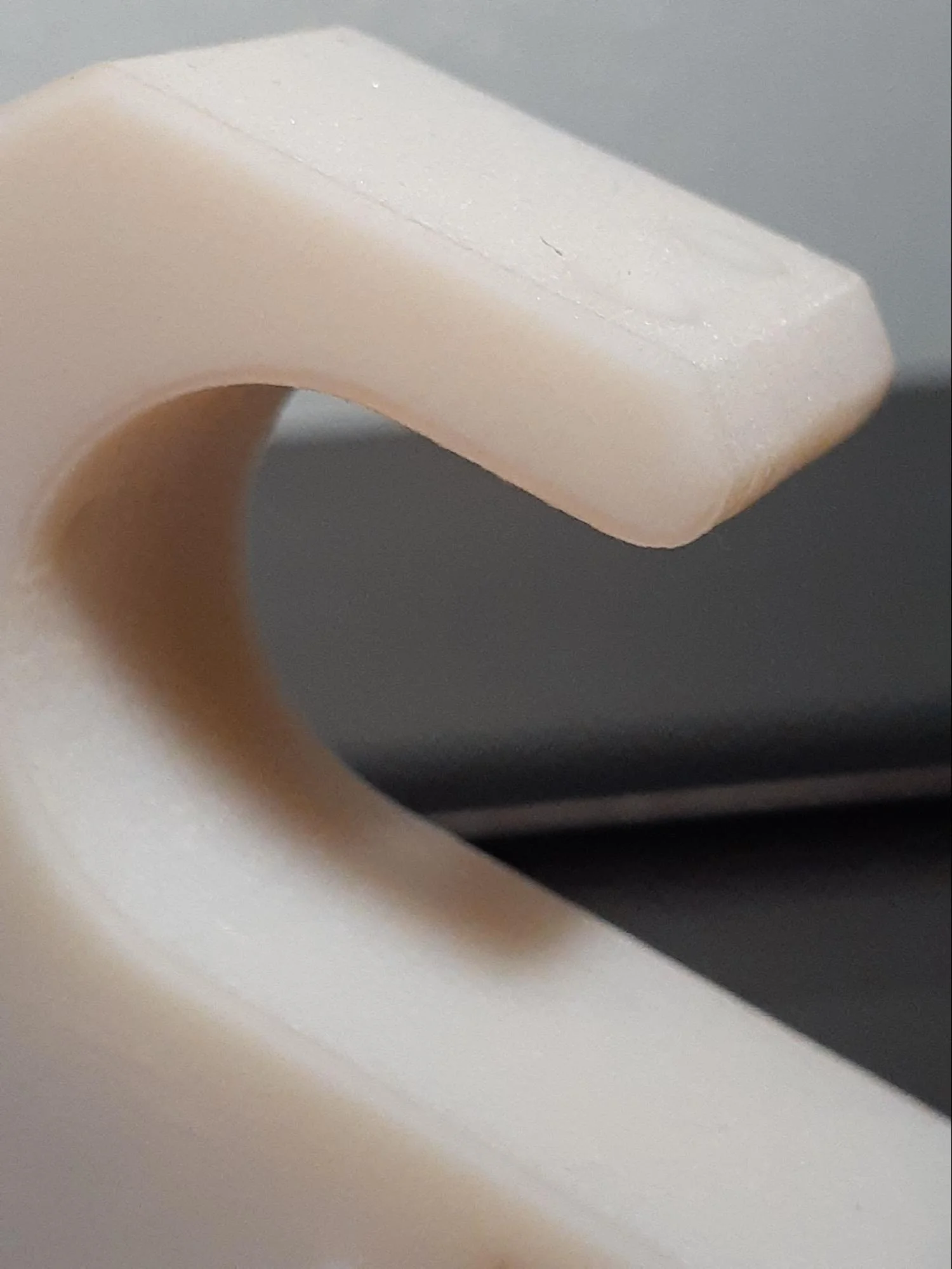 The ABS-like part has a smoother transition from chamfer to fillet at the common edge