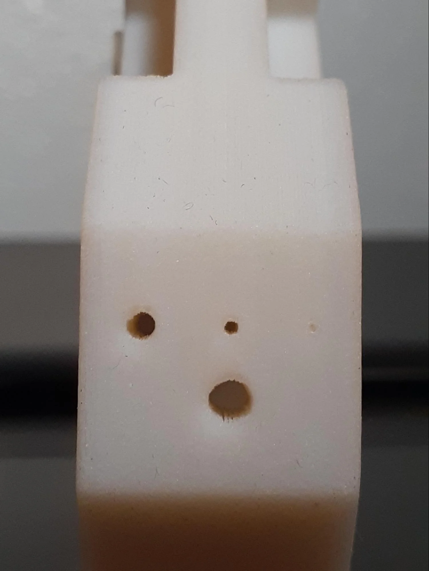 Comparing the different holes on each material from the back end of the parts