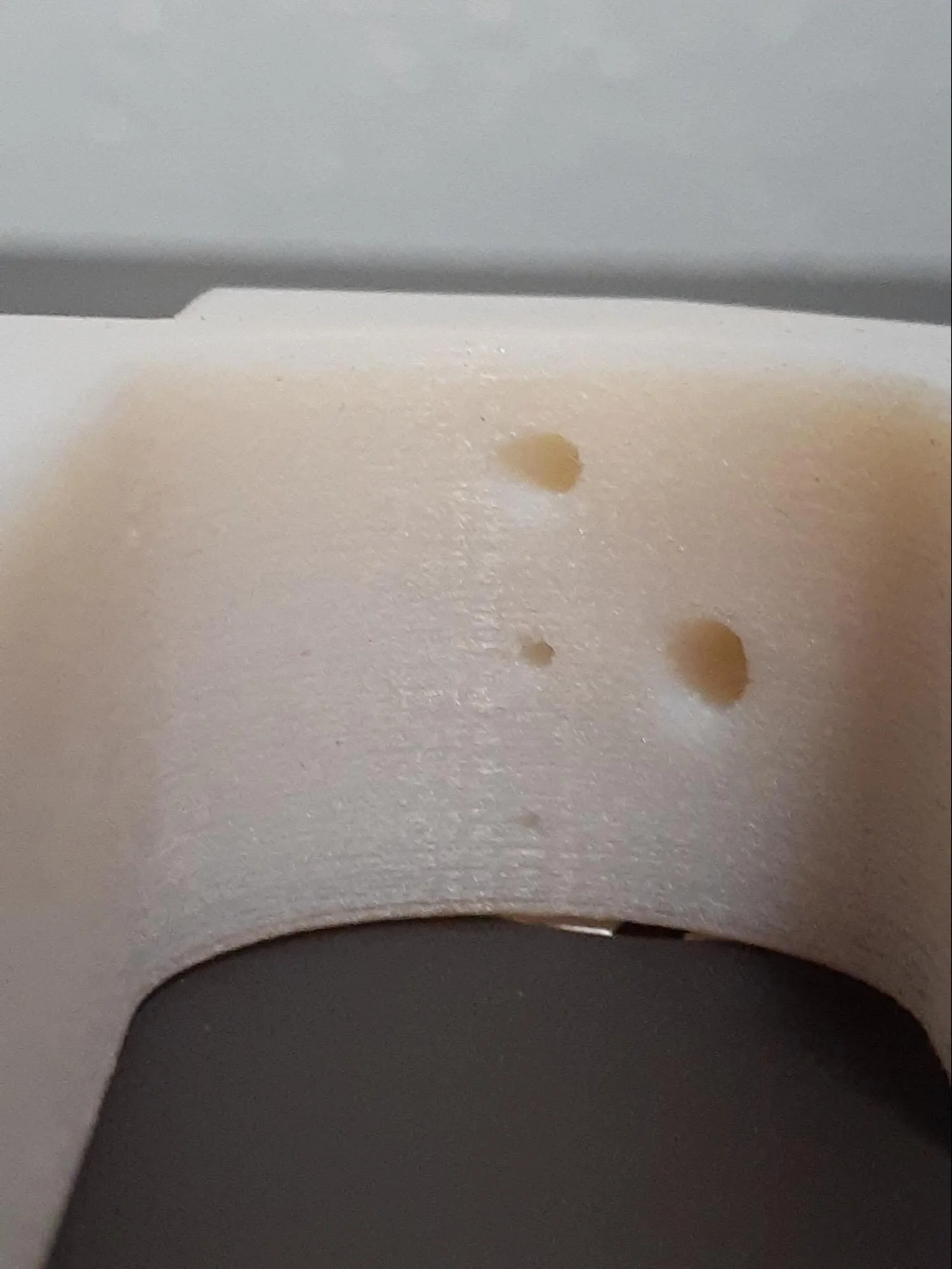 Comparing the different holes on each material from the front along the part’s hidden curved surface