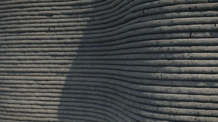 3D printed concrete wall, similar to the ones utilized to 3D print schools
