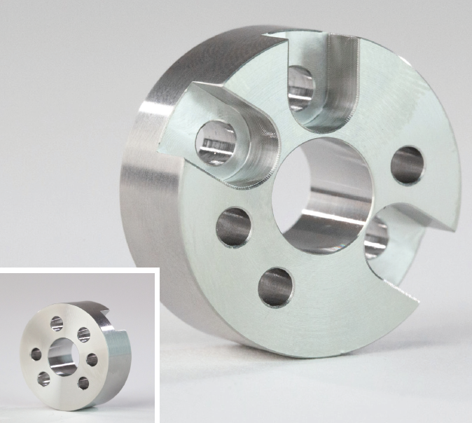 A circular metal part with holes drilled in it, finished using passivation