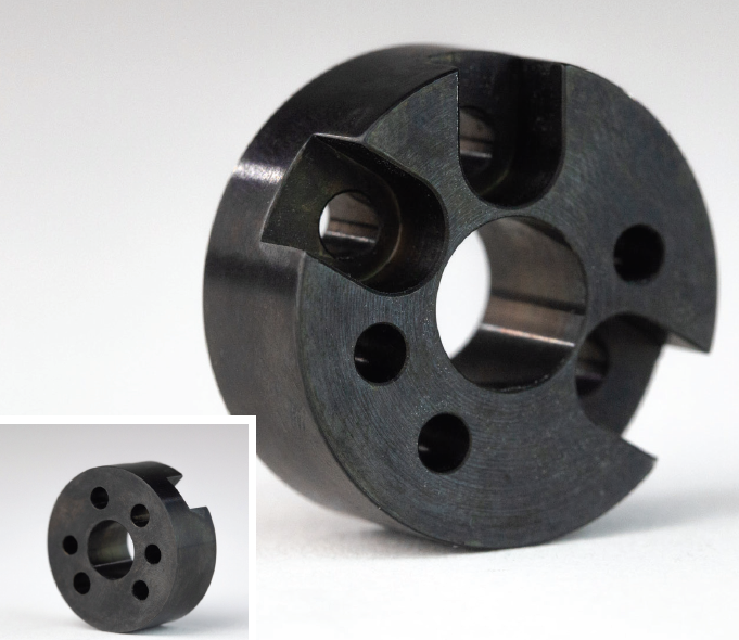 Basic of Finishing CNC Machined Parts 7 A circular metal part with holes drilled in it, finished using black oxide