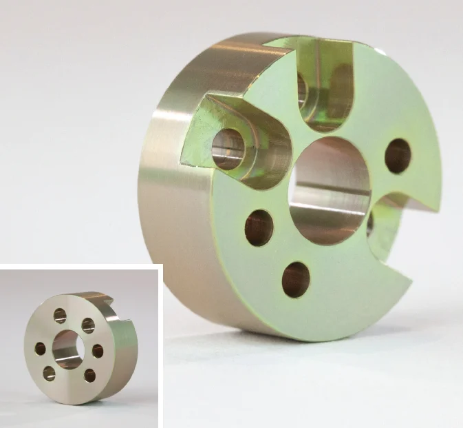 alodine - Fictiv A circular metal part with holes drilled in it, finished using Alodine