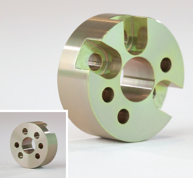 Basic of Finishing CNC Machined Parts 5 A circular metal part with holes drilled in it, finished using Alodine