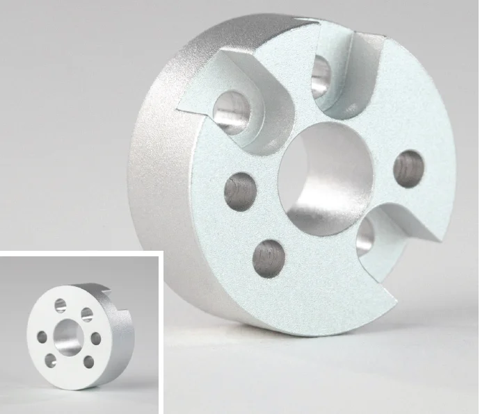 media blasting - Fictiv A circular metal part with holes drilled in it, finished using media blasting