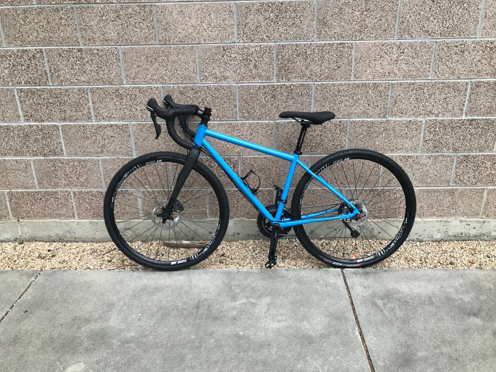 blue bicycle with black wheels