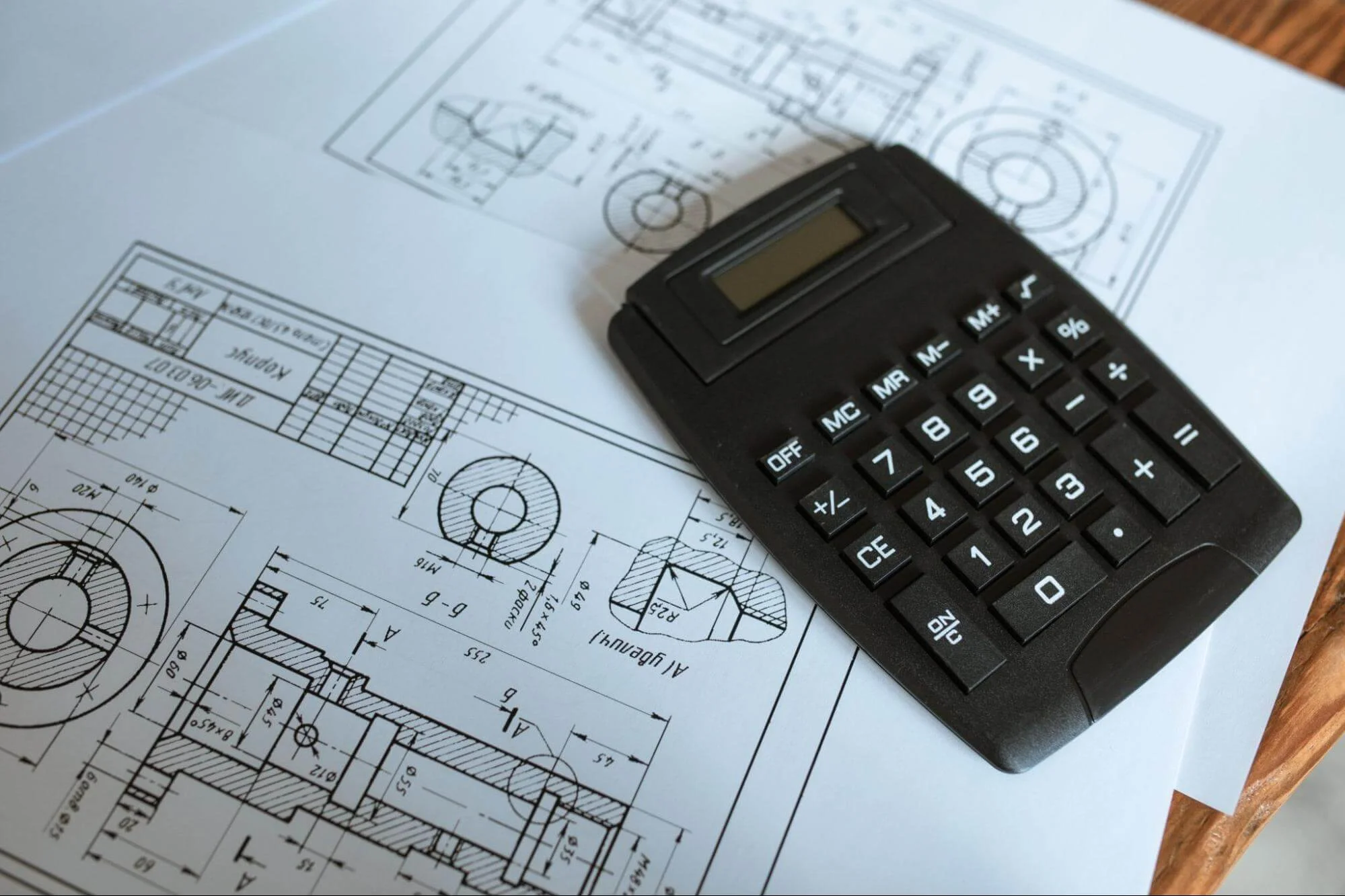engineering drawing with machining tolerances and calculator