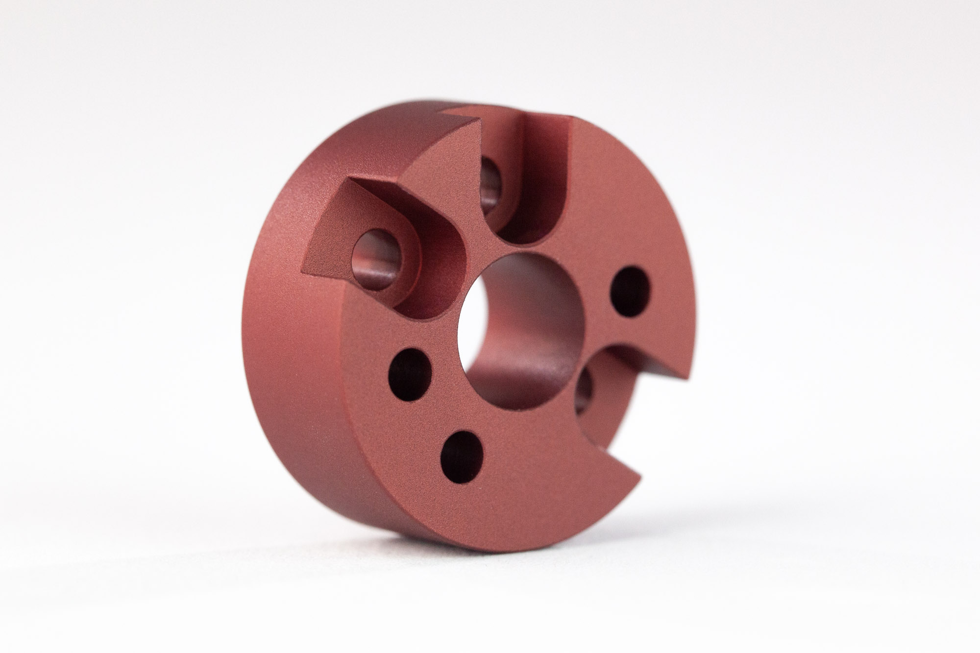 Basic of Finishing CNC Machined Parts 14 a metal part finished with media blasting and red anodizing