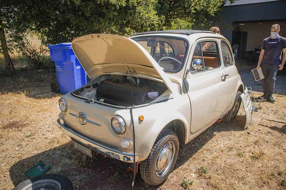 fictiv1image8 - Fictiv image of tan colored 1966 fiat 500 on jack stands with the front trunk open