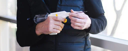 medical-device-stock-image - Fictiv person holding an injection molded medical device