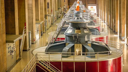 Large turbines spin to create electricity in the powerplant