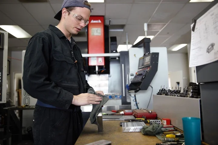 CNC-Machinist-prepares-raw-material - Fictiv CNC Machinist prepares raw material for machining