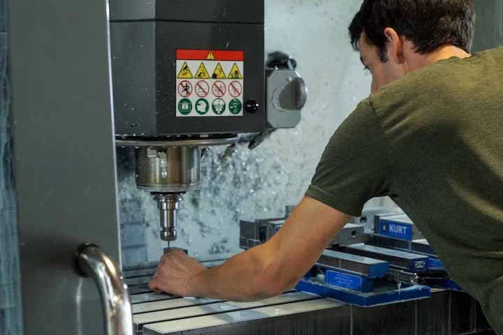 An Operator Sets Up a Part for Machining