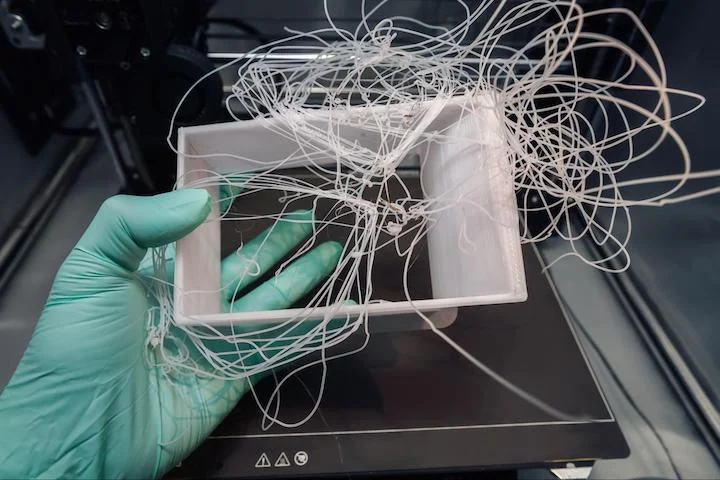 failed 3D print - spaghetti-like filament failure