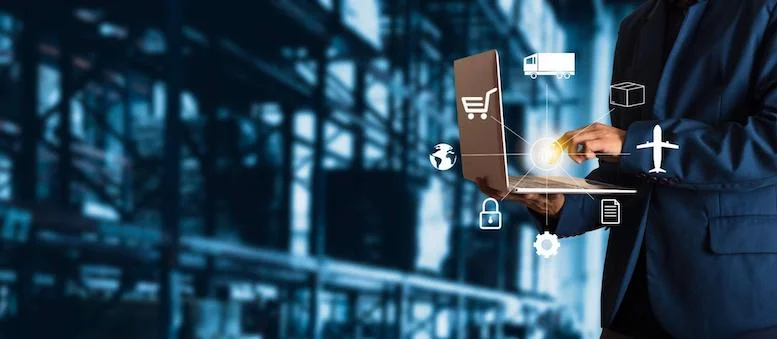 an-operator-utilizes-a-laptop-to-manage-inventory-in-a-warehouse - Fictiv An operator utilizes a laptop to manage inventory in a warehouse
