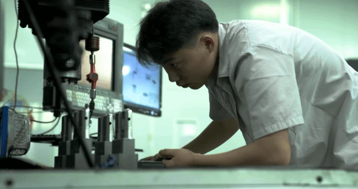 manufacturing-engineer-inspects-injection-molding-tooling - Fictiv manufacturing engineer inspects injection molding tooling