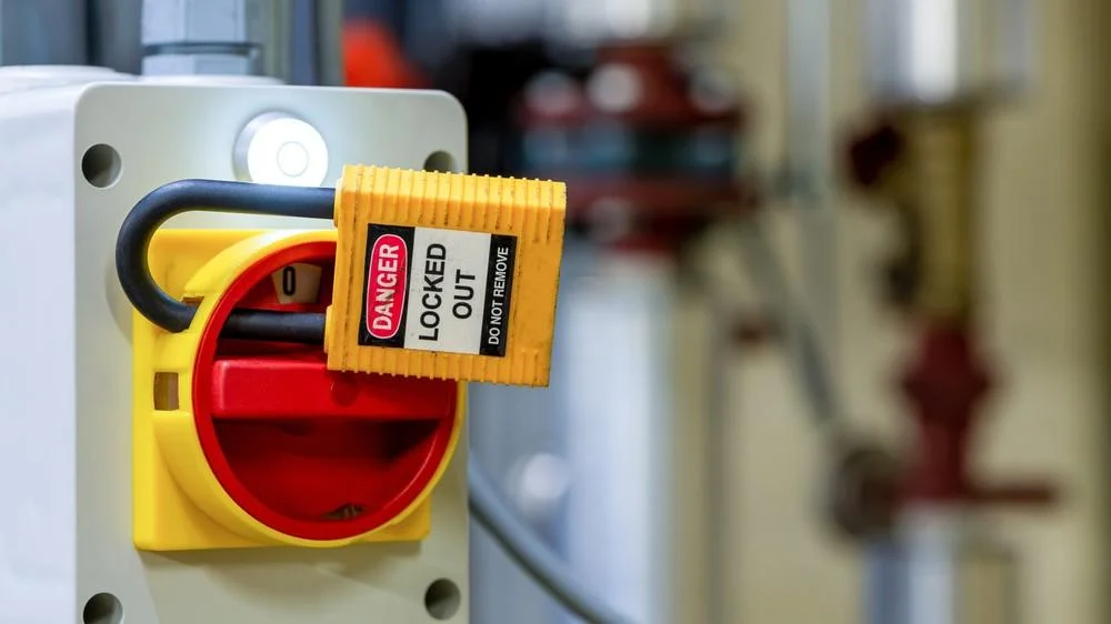 Only authorized personnel should remove locks or tags from CNC machines.