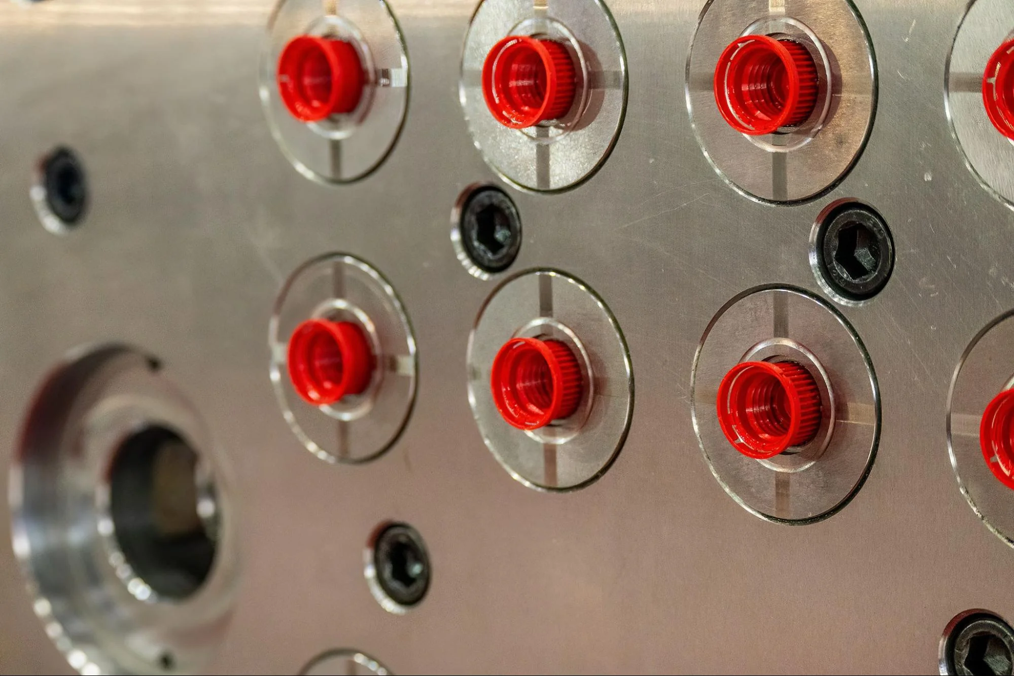 Injection molded plastic caps in the cavity side of a multi-cavity mold.