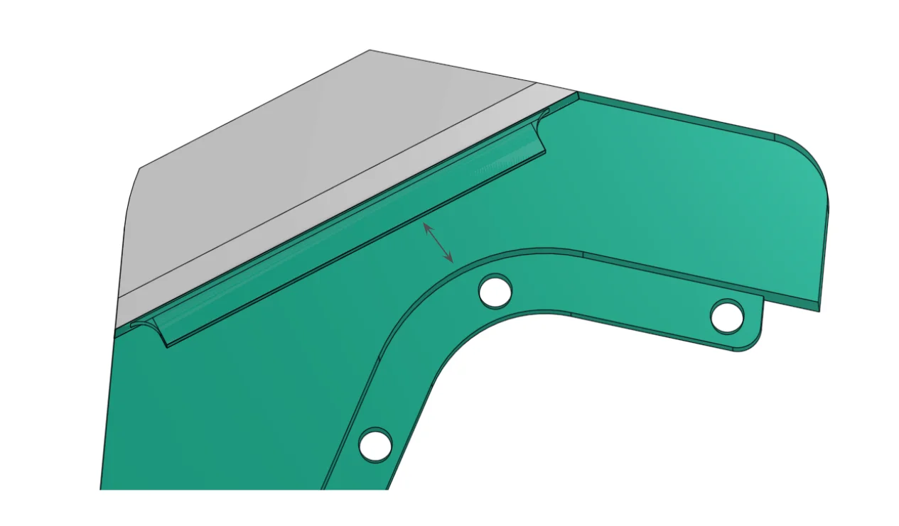 Metal box-cutter blade is insert-molded with a plastic phone stand component.