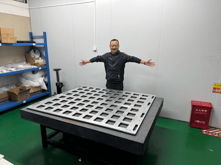 Large CNC part with human for scale.