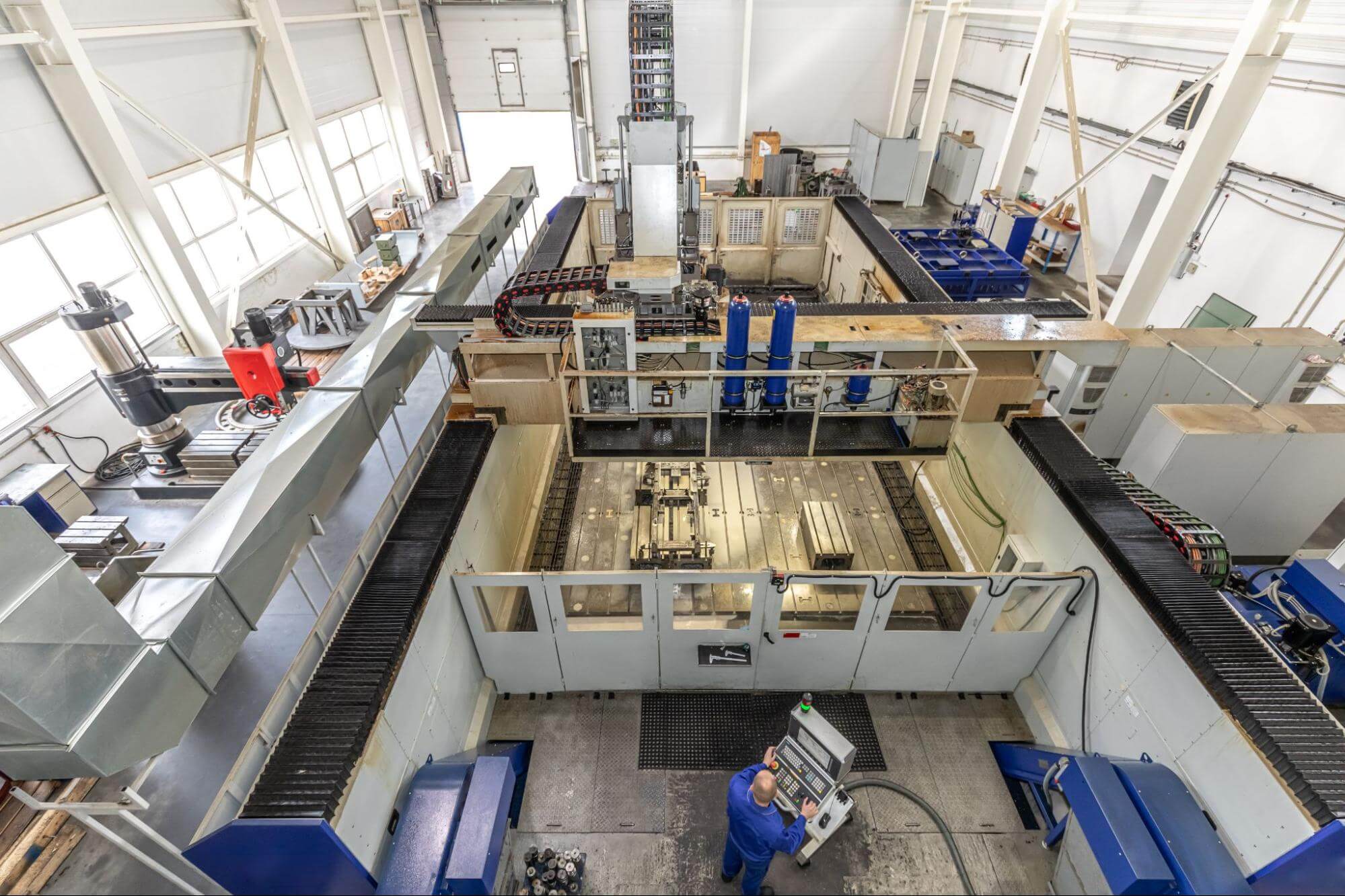 Large-format CNC machines in a factory.