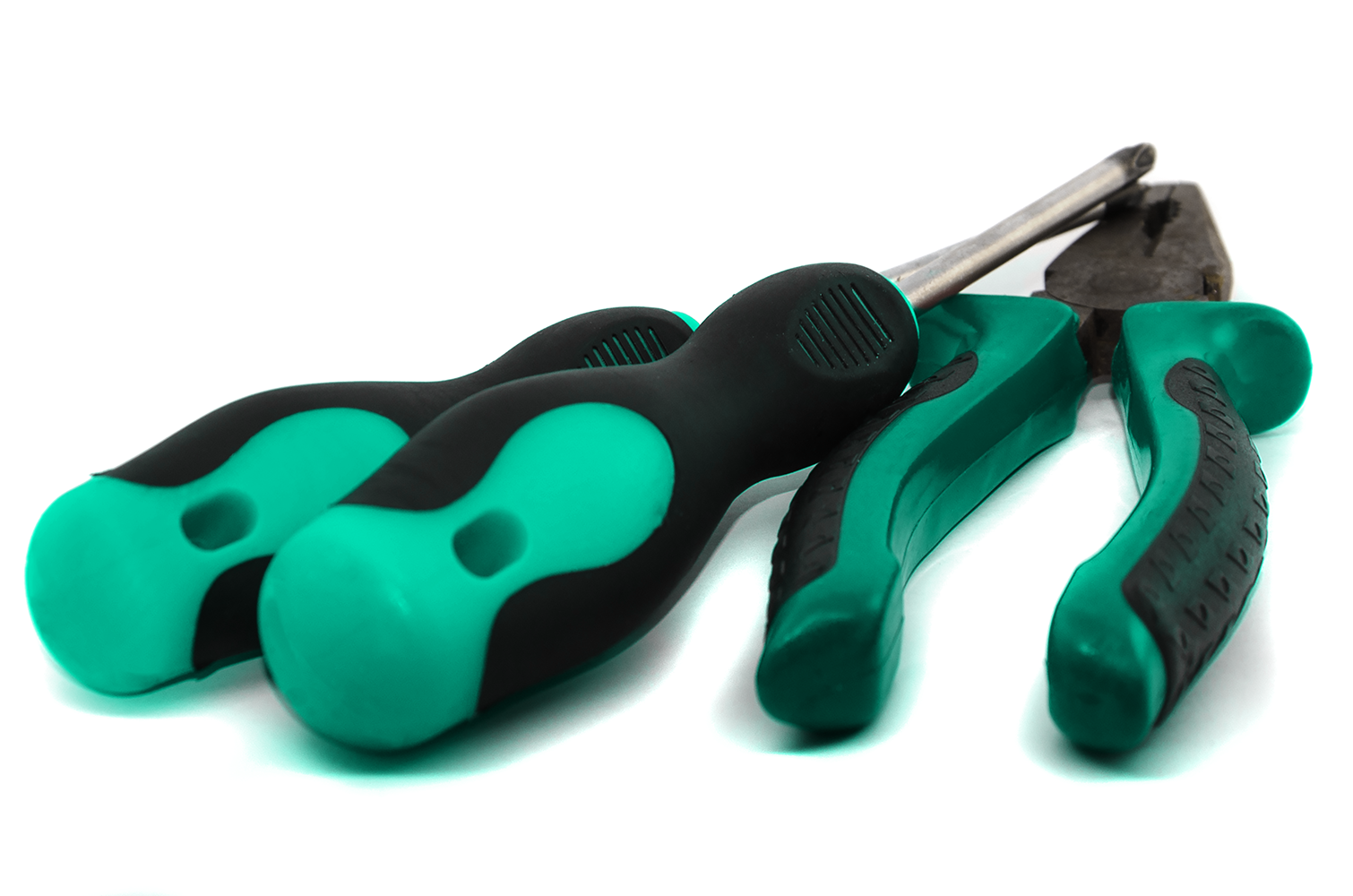 Insert-molded tools with a rubber-like grip overmolded.
