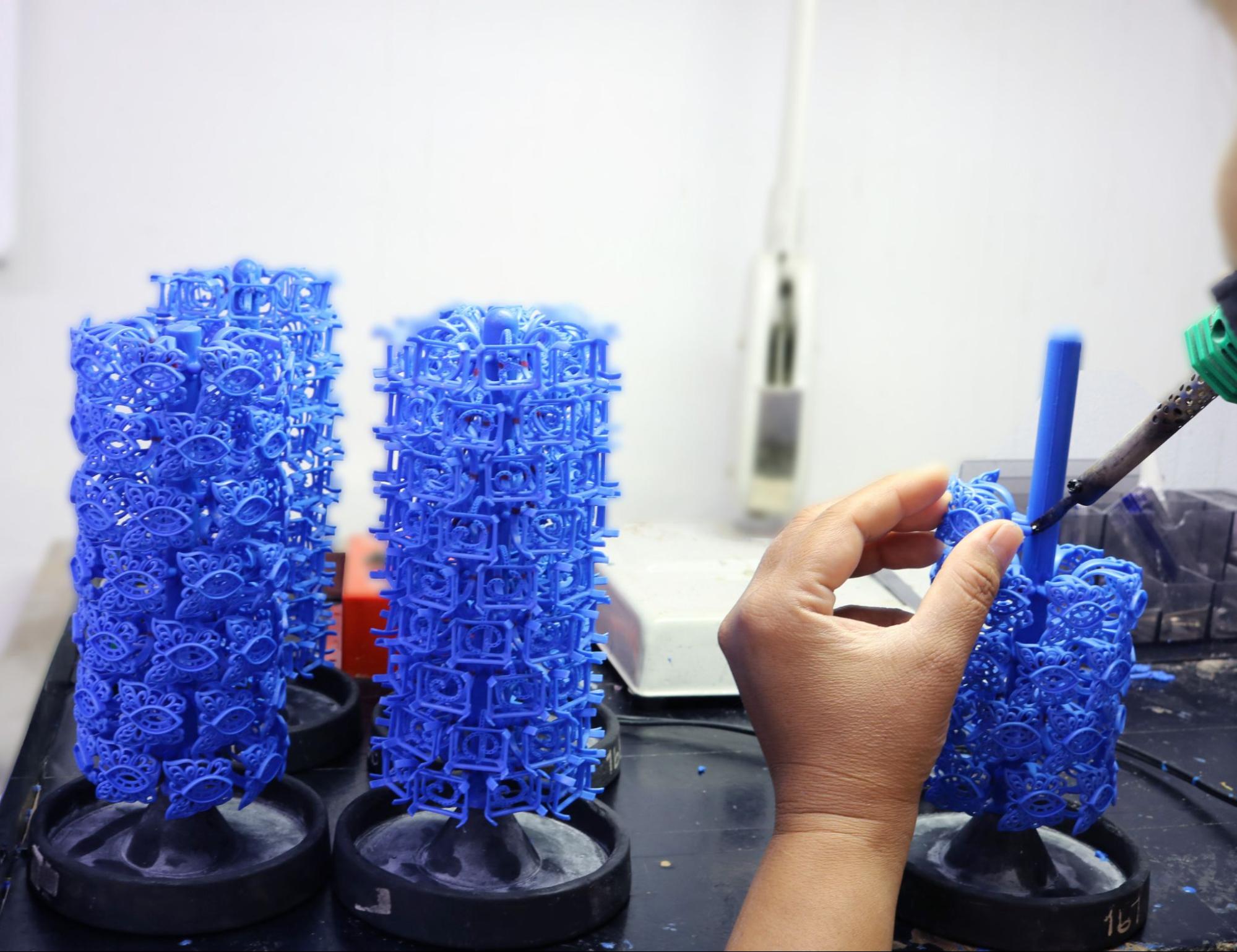 Wax tree preparation for an investment-cast jewelry mold.