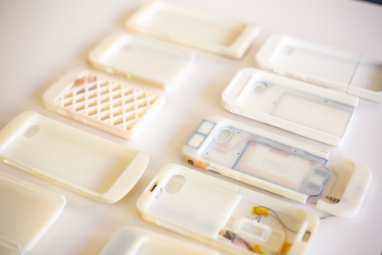 #3D-printed prototype phone case iterations
