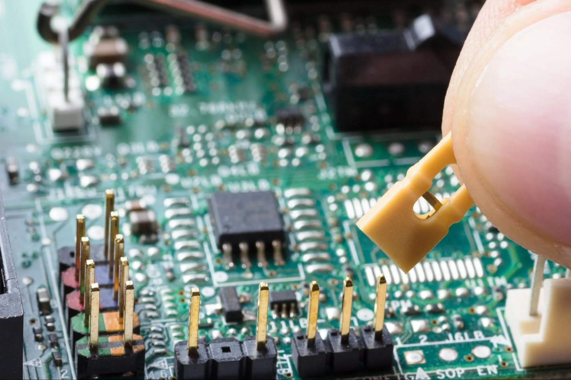 Circuit boards feature small molded components, including motherboard jumper covers and microconnectors.