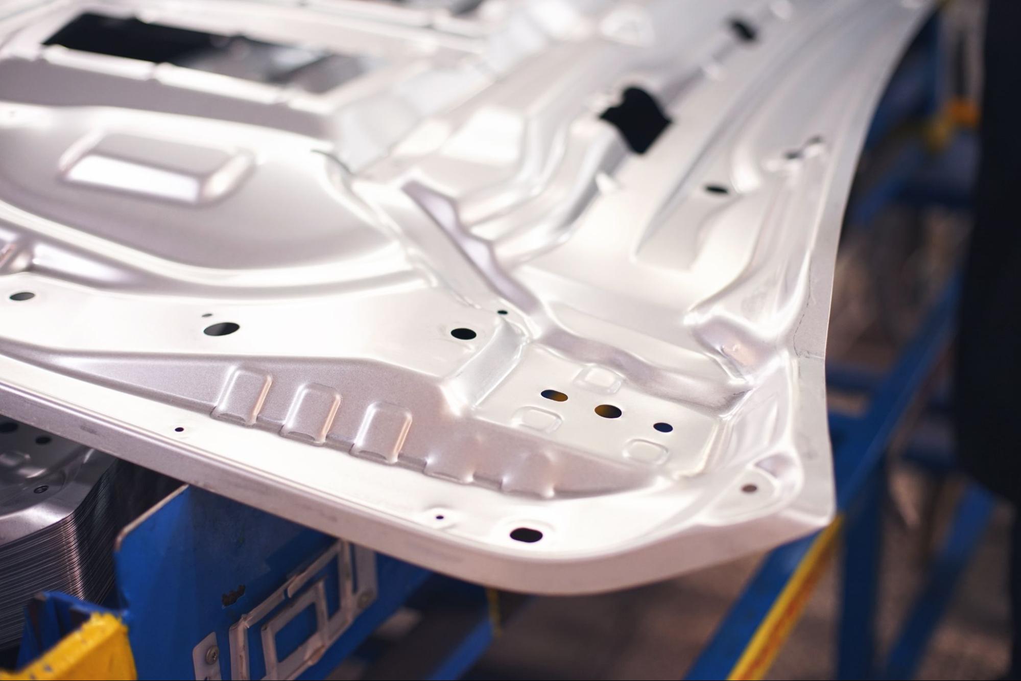 A stamped metal automotive part.