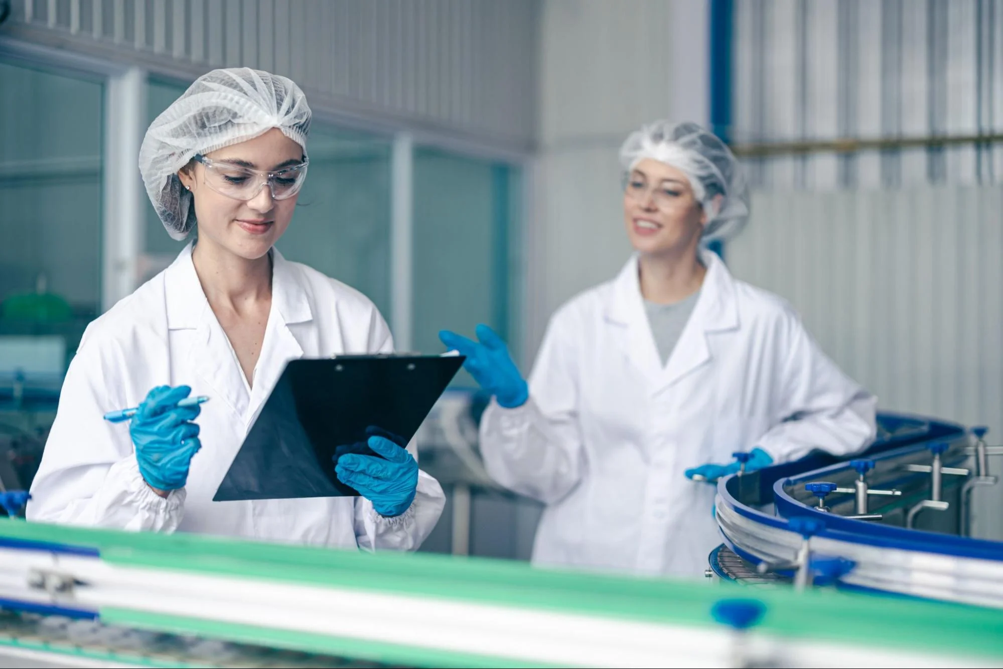 qa-in-manufacturing-blog-img-3 - Fictiv A quality control team on the production line inspecting products.