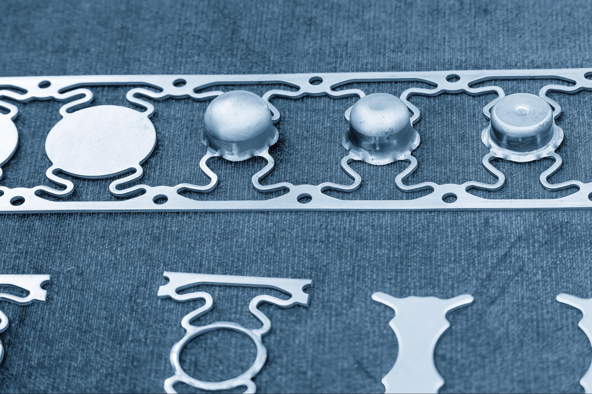 Metal parts made with a progressive die.