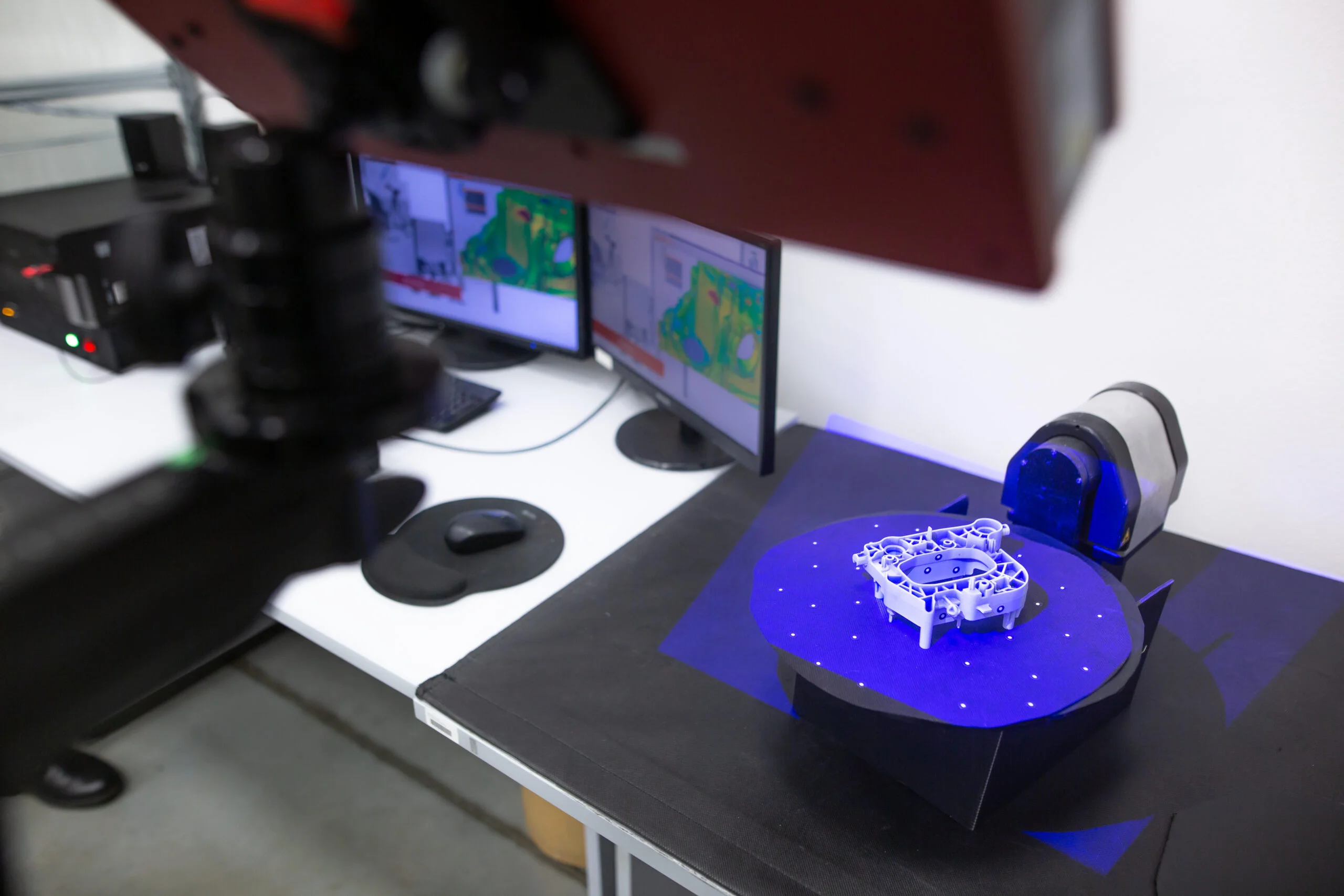 Professional 3D scanner scanning an industrial object plastic molding placed on a turntable metrology concept - Fictiv Reverse engineering with 3D scanning
