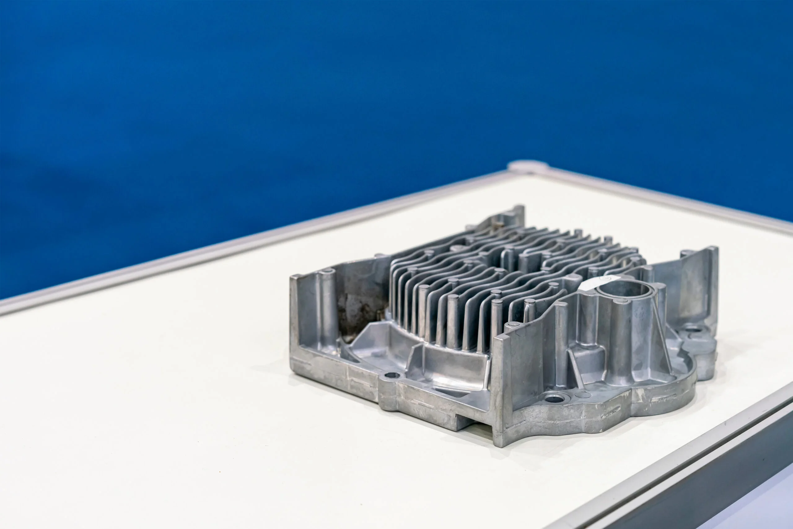 aluminum or alloy engine or pump for automobile part from high pressure die casting manufacturing process on table - Fictiv A die-cast part properly designed to reduce defects