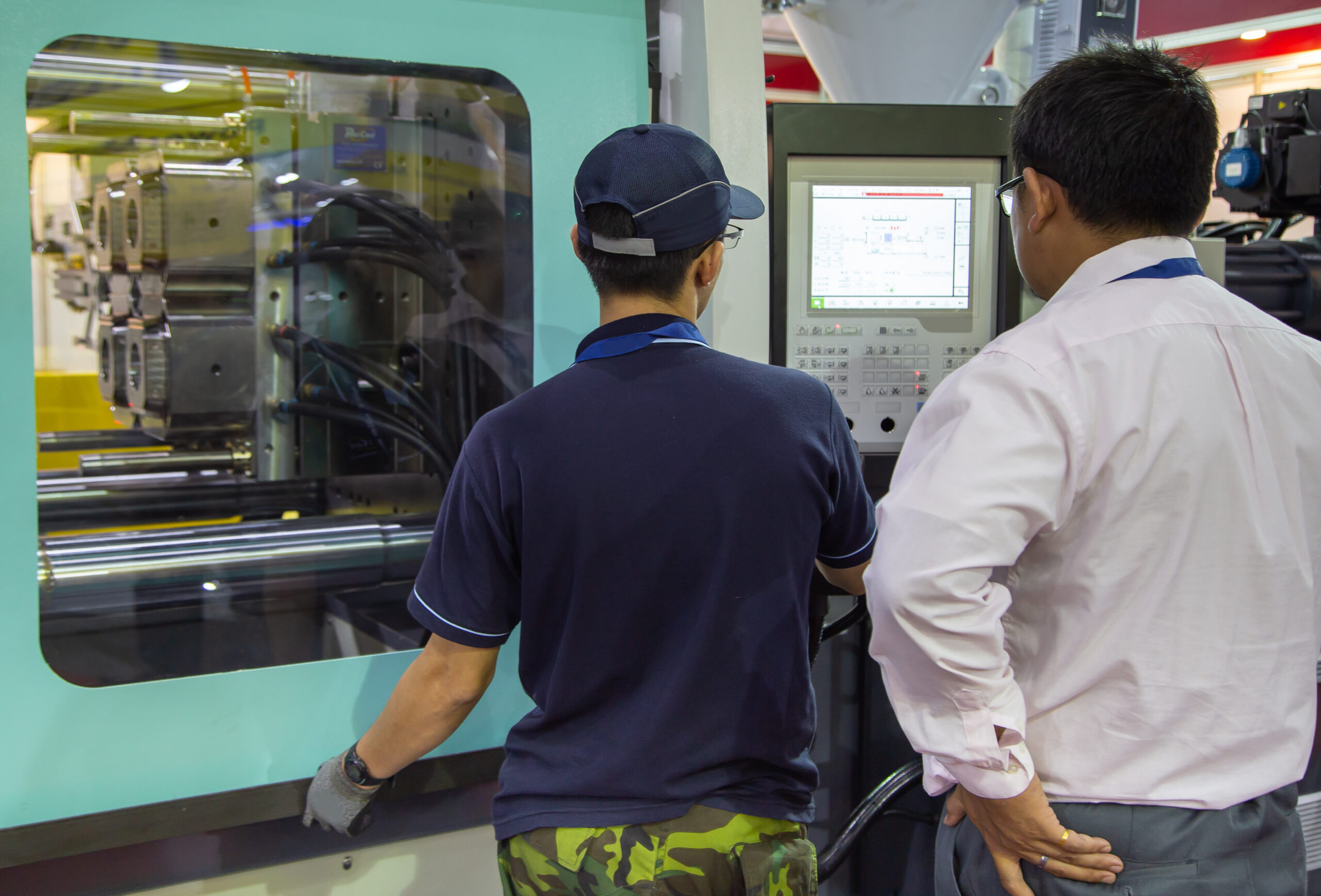 Injection Molding Cycle Time Reduction - Fictiv Injection molding factory workers adjust process parameters to reduce cycle time