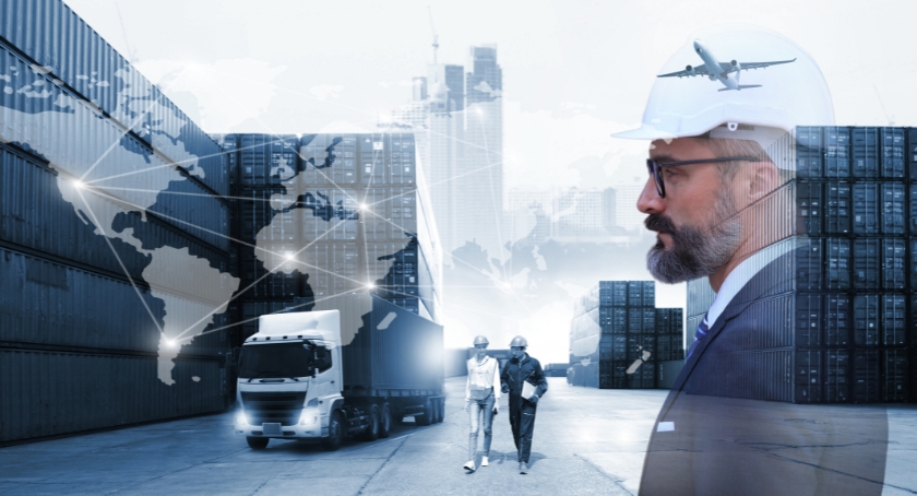 Global logistics scene with shipping containers, a truck, two workers, and a suited supervisor over a world map network overlay.