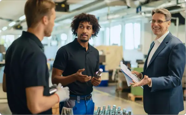 Manufacturing engineers discussing a project on the factory floor