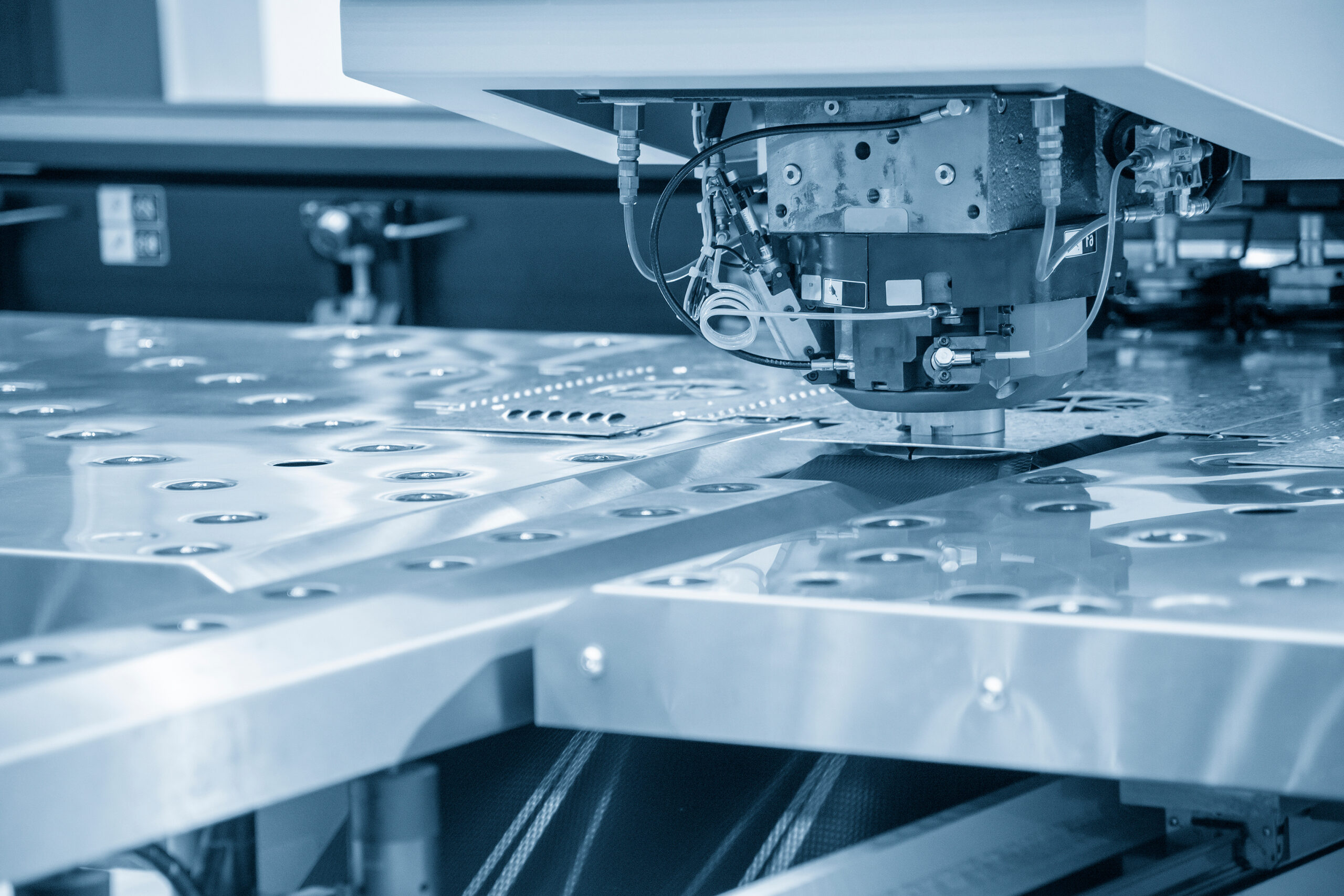 Turret Punching, Laser Cutting, and Combination Machines: A Design and Process Guide